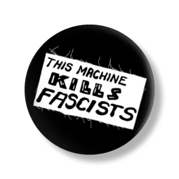 A black pin with the phrase This Machine Kills Fascists.