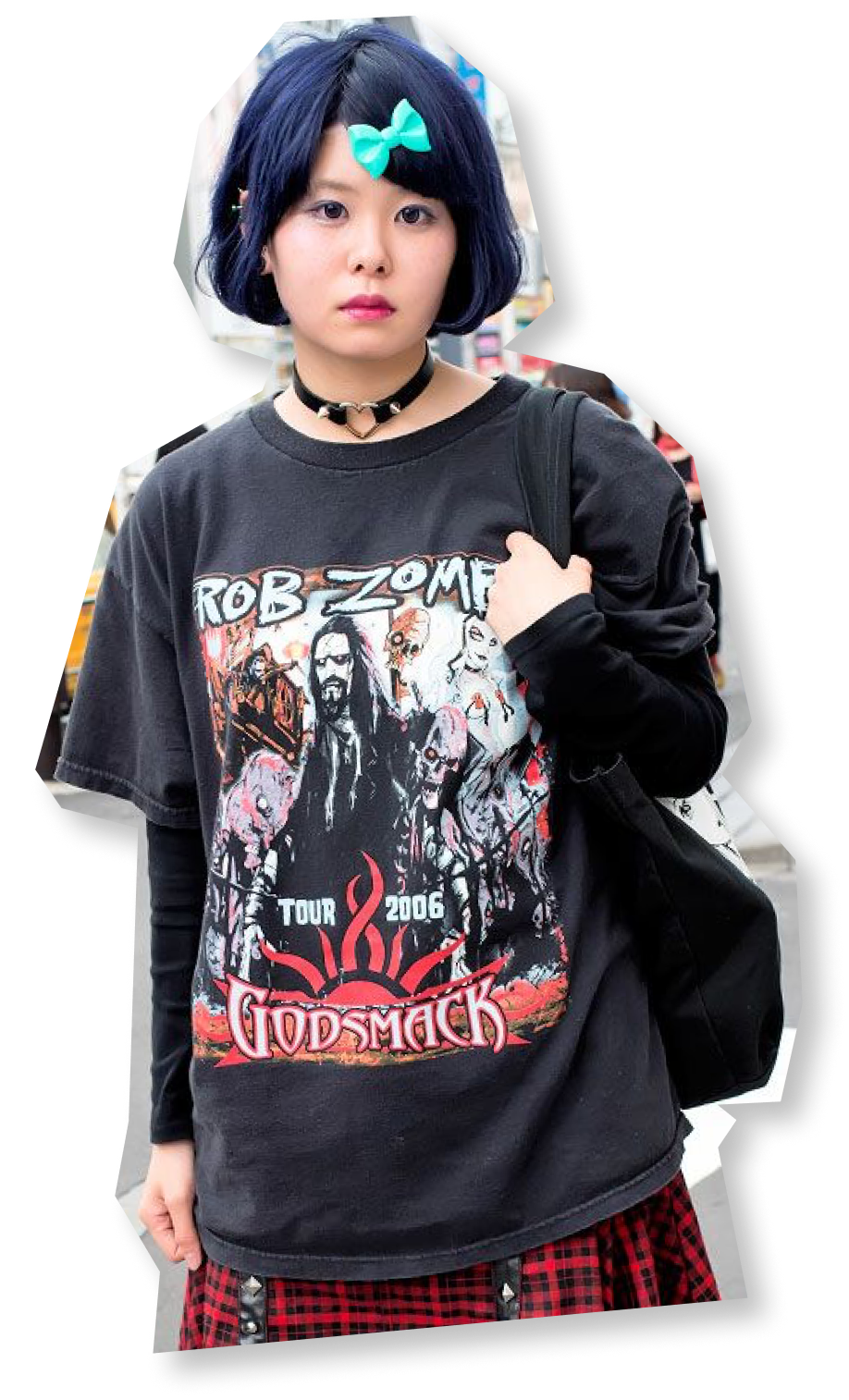 A young Asian woman with a short bob, bow, choker, and Rob Zombie t-shirt.